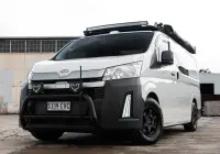 Toyota HiAce H300 Van with ROH Torque Matte Black Wheels in industrial area