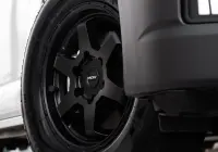 Toyota HiAce H300 Van with ROH Torque Matte Black Wheels in industrial area