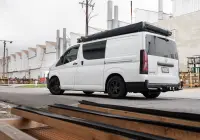 Toyota HiAce H300 Van with ROH Torque Matte Black Wheels in industrial area