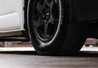 Toyota HiAce H300 Van with ROH Torque Matte Black Wheels in industrial area