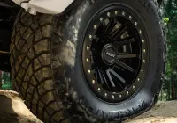 Close up of white Nissan GQ Patrol Wagon with ROH HYBRIDLOCK Zullo 17x9 -22 Matte Black 4x4 Wheel