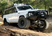White Nissan GQ Patrol Wagon with ROH HYBRIDLOCK Zullo 17x9 -22 Matte Black 4x4 Wheel off road