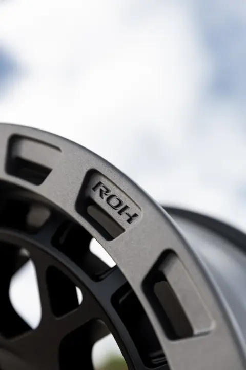 Close-up of ROH logo on Atlas Black Centre Graphite Lip 4x4 Wheel on Sand Dunes