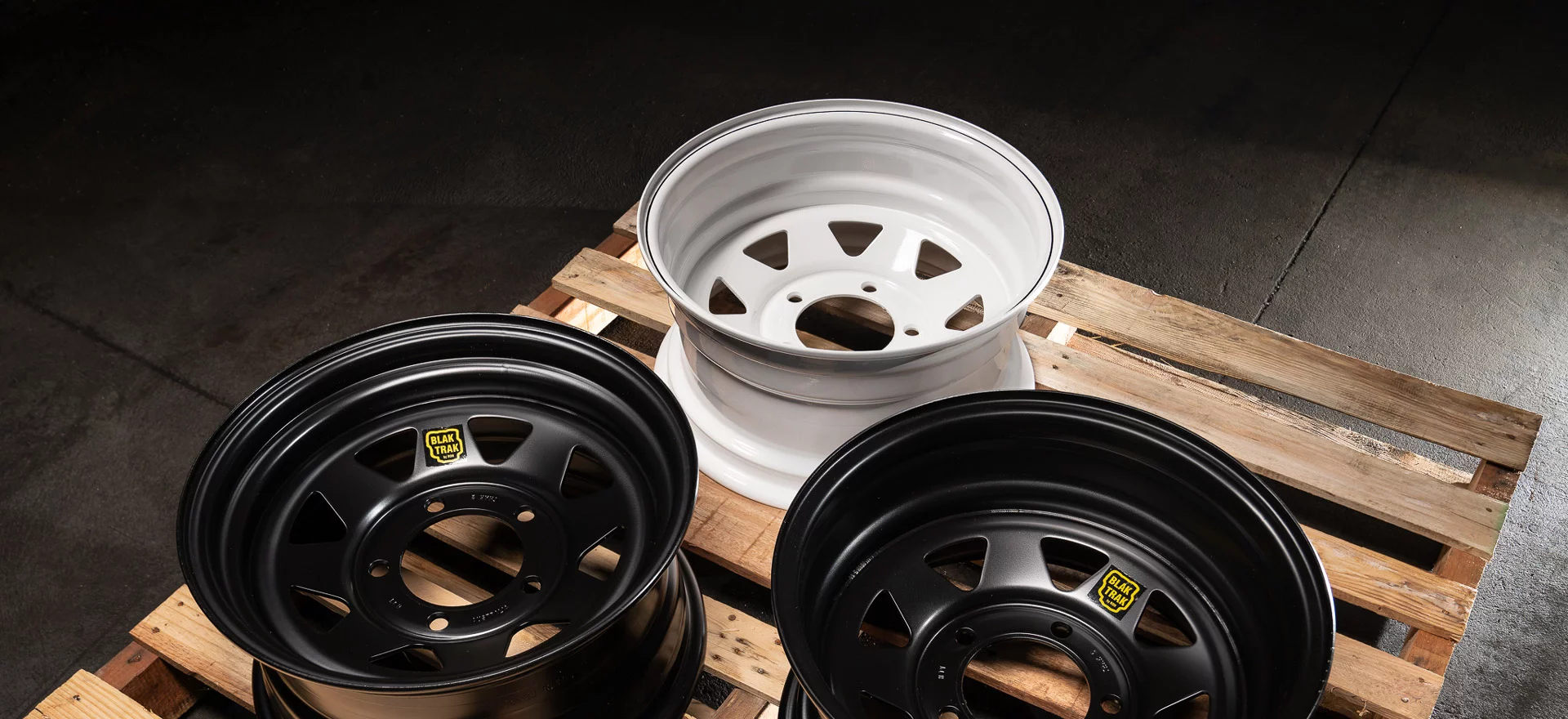 Black and White ROH Trak steel wheels on a pallet