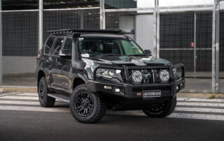 Toyota Prado with Vapour wheels on road in carpark