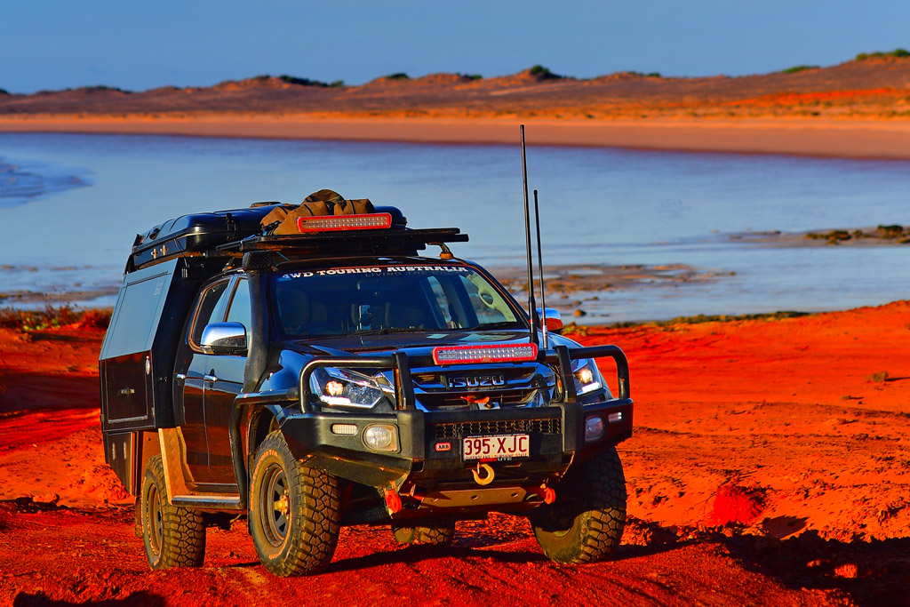Sunraysia Steel 4WD Touring DMAX lake red dust background