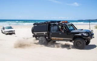 4x4 Wheels Toyota Landcruiser 79 series towing on the beach