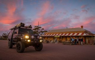 ROH Vapour wheels on 79 Series LandCruiser in front of local outback pub