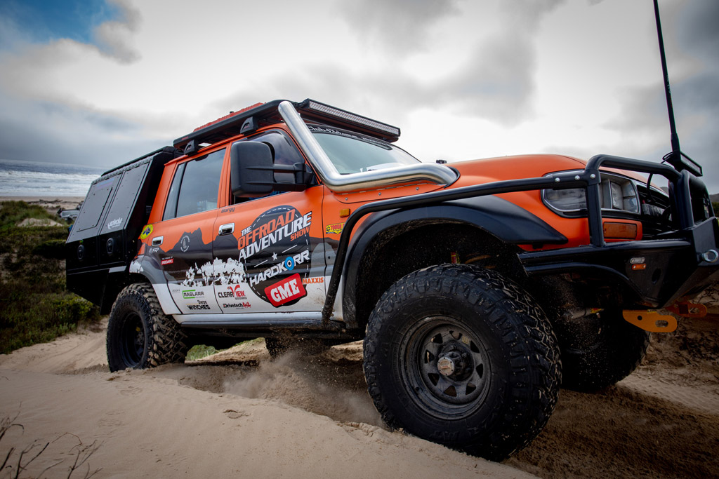 Toyota LandCruiser 4WD Steel wheels on Offroad Adventure Show driving through sand dunes