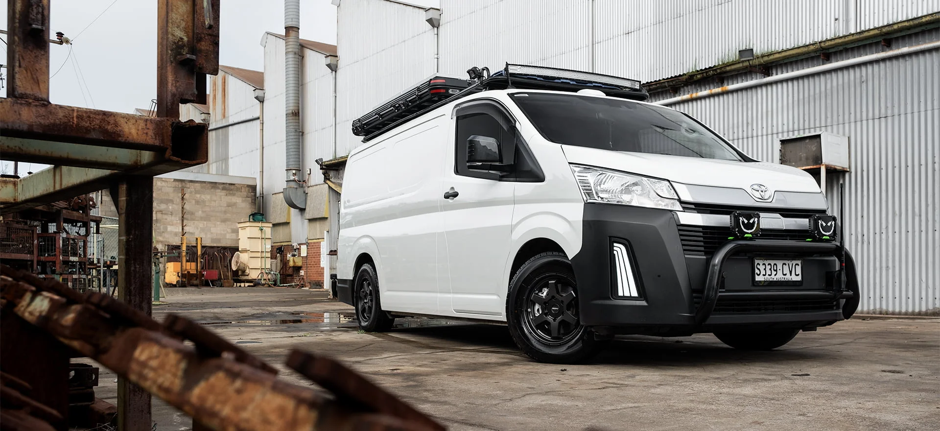 Toyota Hiace Van with Matt Black ROH Torque Wheels in Industrial Area
