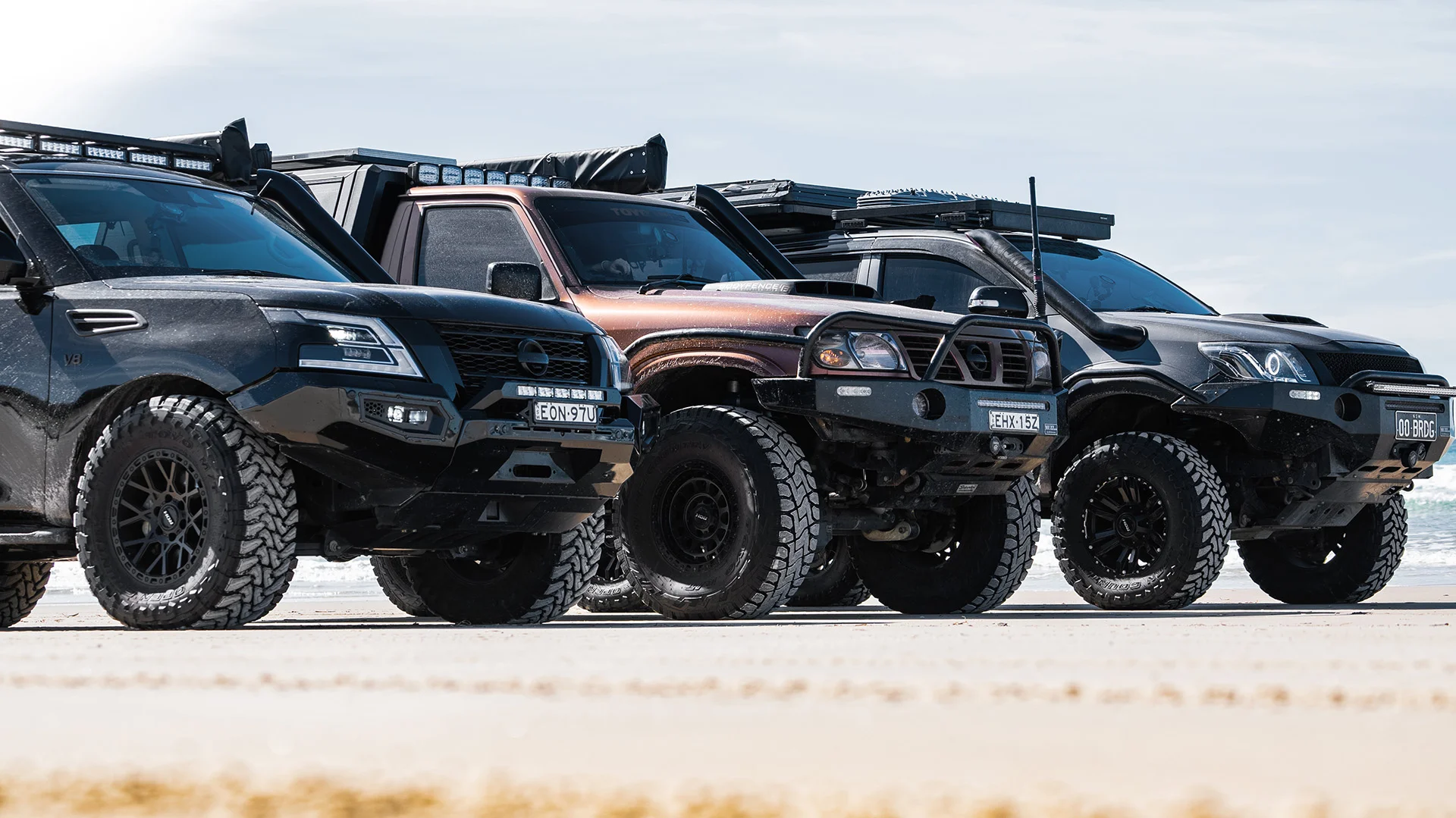 Red Dirt Diary vehicles with ROH Wheels on beach