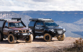 Red Dirt Diary Patrol and Hilux with ROH Wheels at scenic view