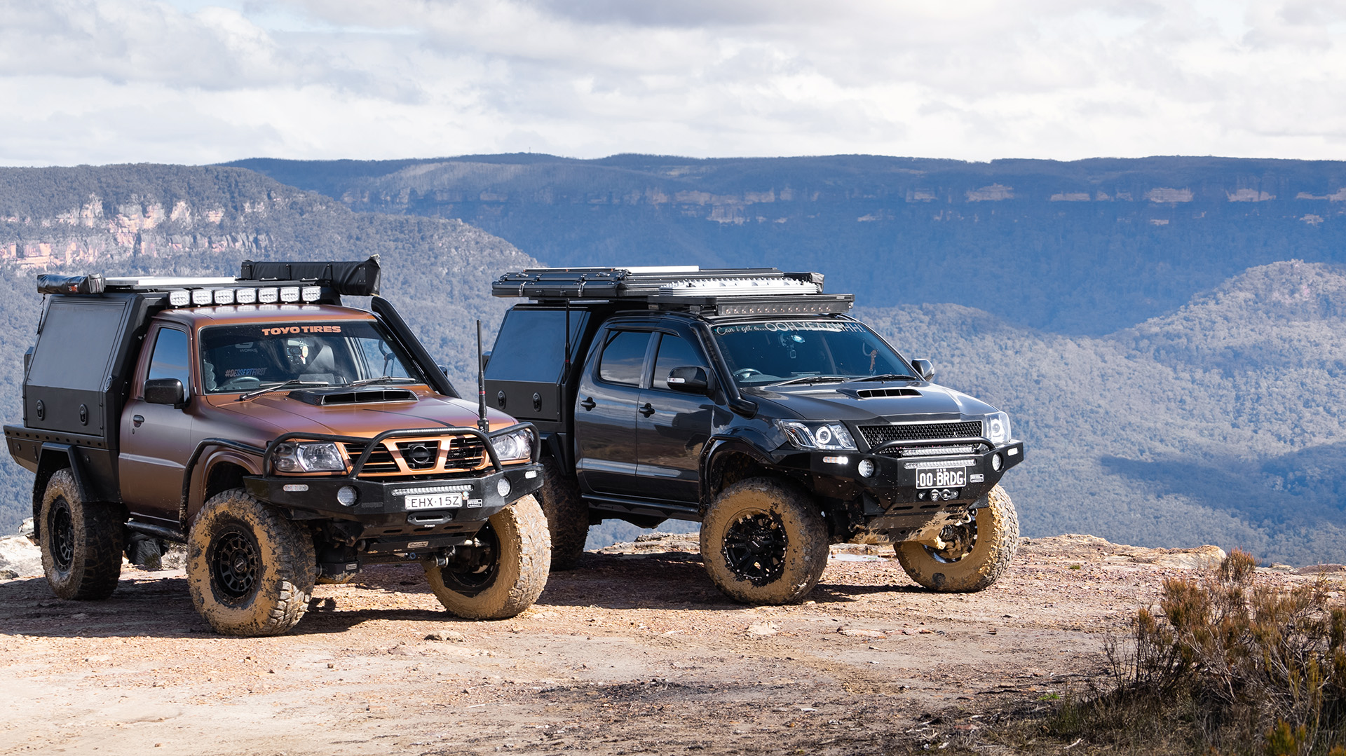 Red Dirt Diary Patrol and Hilux with ROH Wheels at scenic view