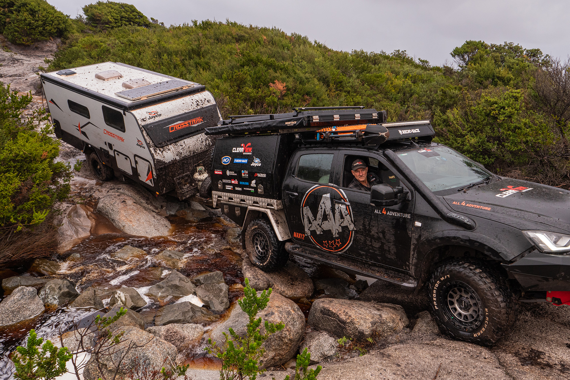 All 4 Adventure D-Max on Assault wheels rock crawling on wet track