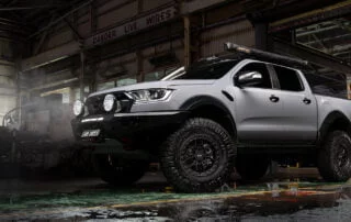 Ford Ranger with Axe Matt Black wheels in dark warehouse